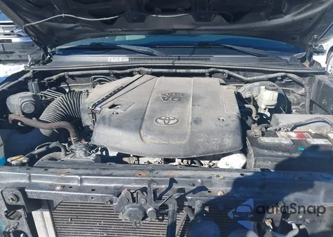 2015 Toyota Tacoma Base V6 z USA, uszkodzony, nr VIN 3TMLU4EN9FM182297